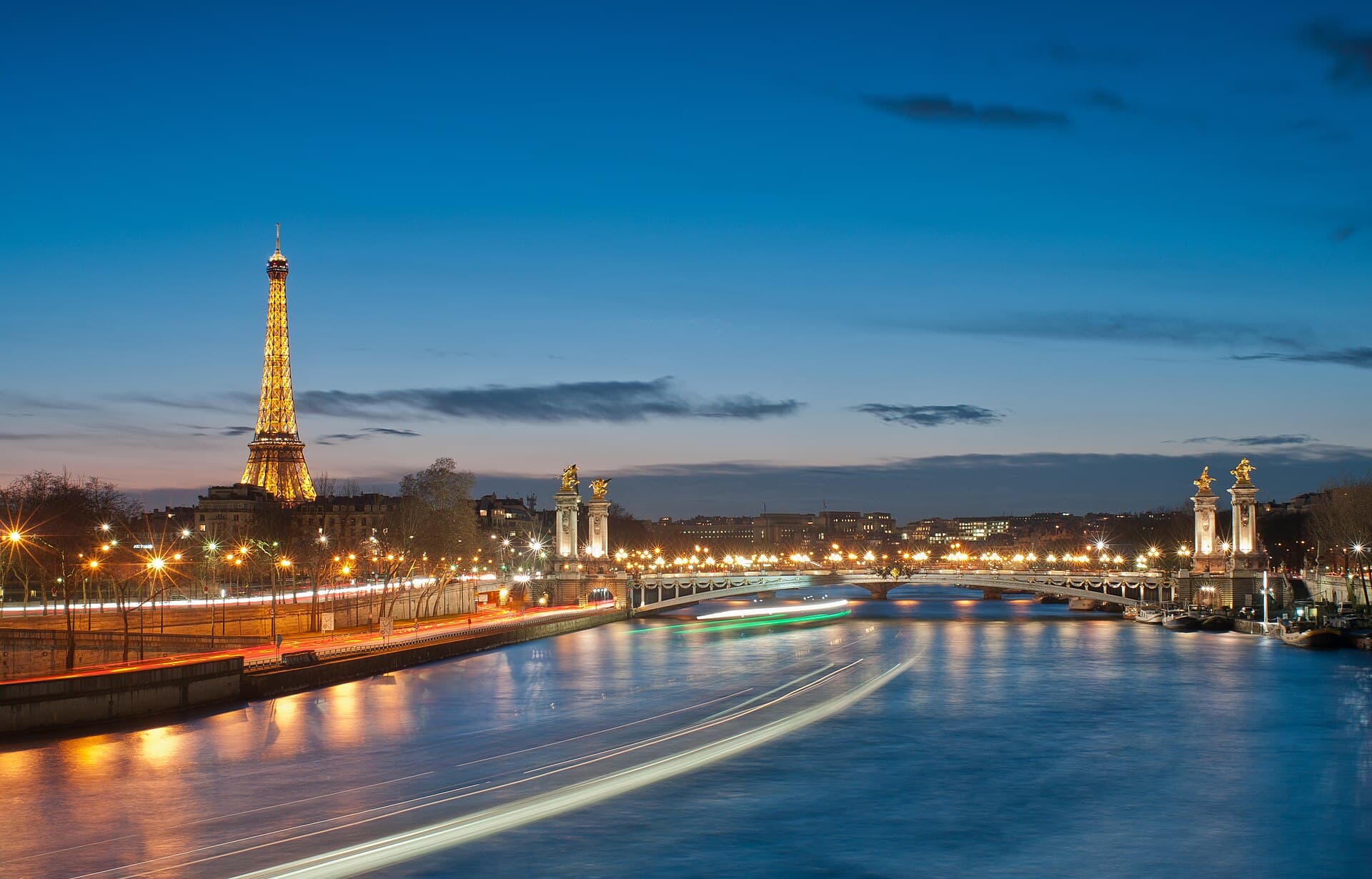 The Eiffel Tower and Pont Alexandre III over the Seine in Paris at night